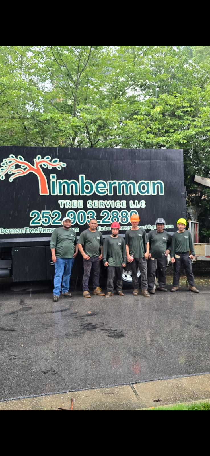The Timberman Tree Service team beside their work truck in Wake County, North Carolina
